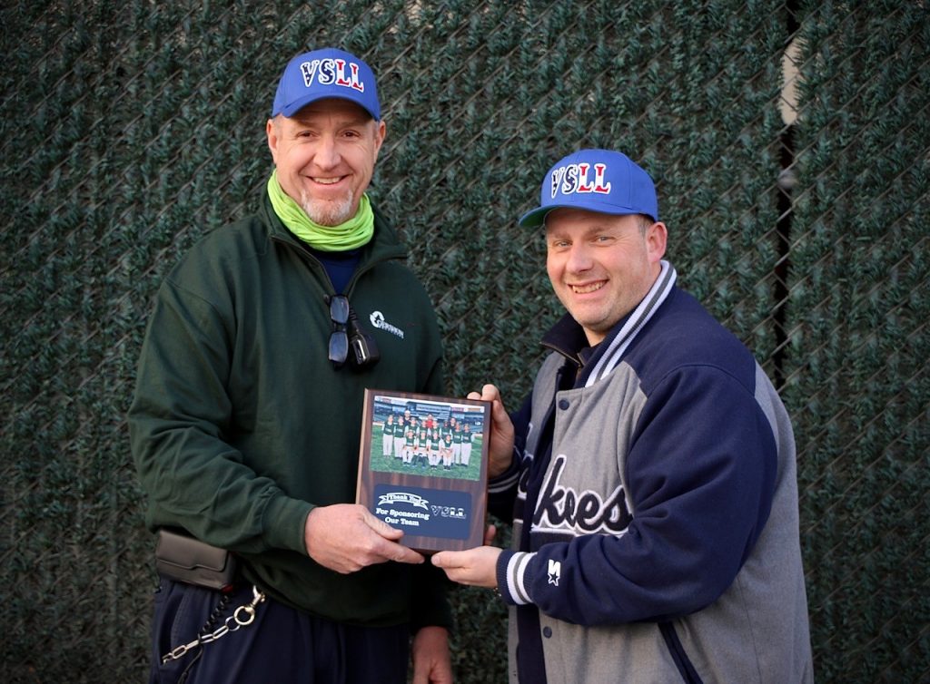 Gershow Manager Peter O’Donovan (left) is presented with a plaque from Valley Stream Little League Vice President James Fischman (right) thanking Gershow for its support.