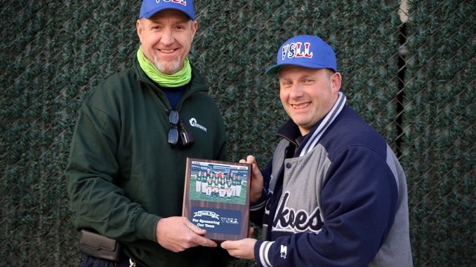 Gershow Manager Peter O’Donovan (left) is presented with a plaque from Valley Stream Little League Vice President James Fischman (right) thanking Gershow for its support.