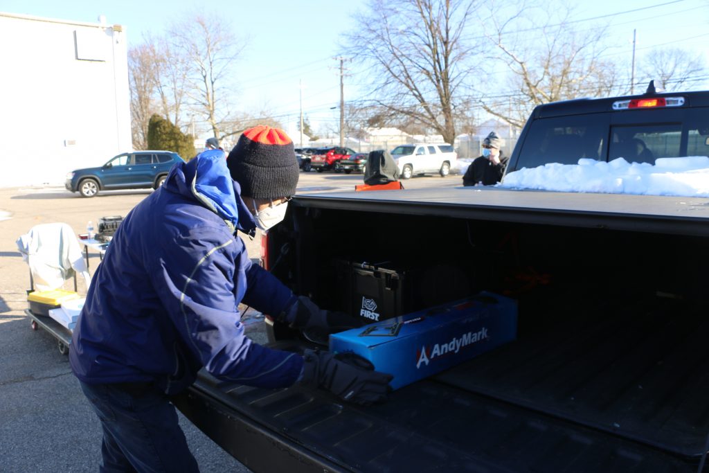 School-Business Partnerships of Long Island, Inc. (SBPLI) DBA Long Island FIRST volunteers distribute kits of parts to local team leaders as part of the FIRST Robotics Competition season kickoff at SCHENCK USA CORP. in Deer Park on January 8.