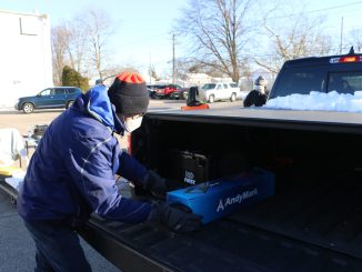 School-Business Partnerships of Long Island, Inc. (SBPLI) DBA Long Island FIRST volunteers distribute kits of parts to local team leaders as part of the FIRST Robotics Competition season kickoff at SCHENCK USA CORP. in Deer Park on January 8.