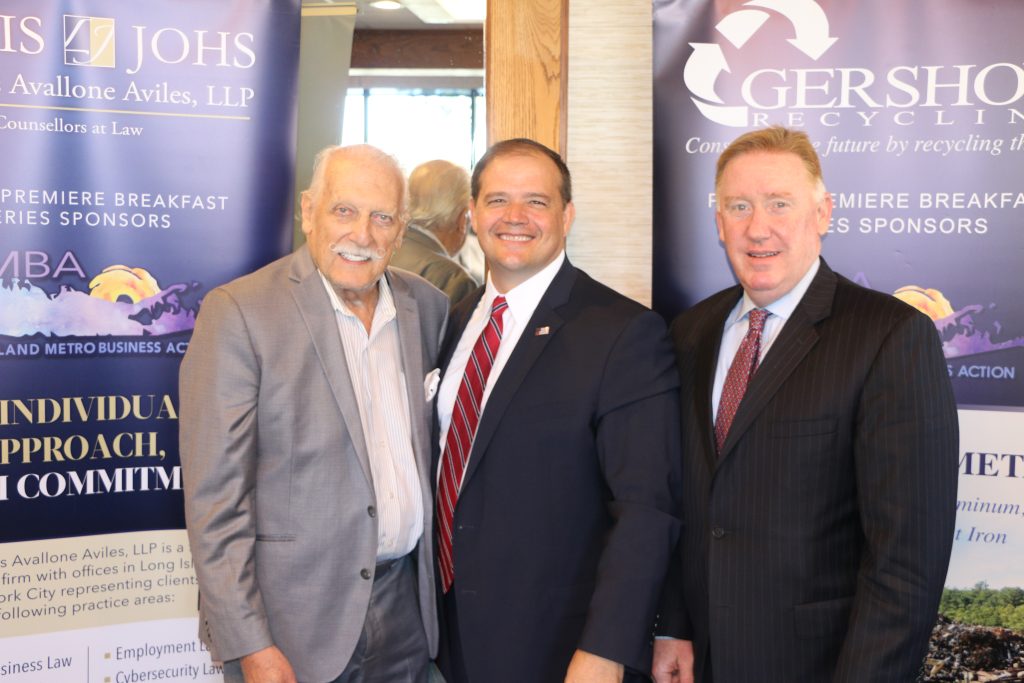 Suffolk County District Attorney Ray Tierney (center) is joined by LIMBA Chairman Ernie Fazio (left), Robert Doyle (right), principal of Lewis Johs Avallone Aviles LLP and LIMBA Board Member.