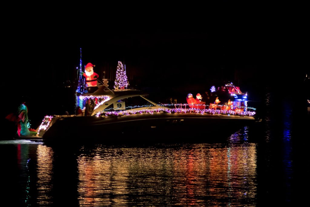 This boat parade contestant is Christmas themed with Santa Claus, lights and a Christmas tree on the boat. (Photo Courtesy of the Huntington Lighthouse Preservation Society)