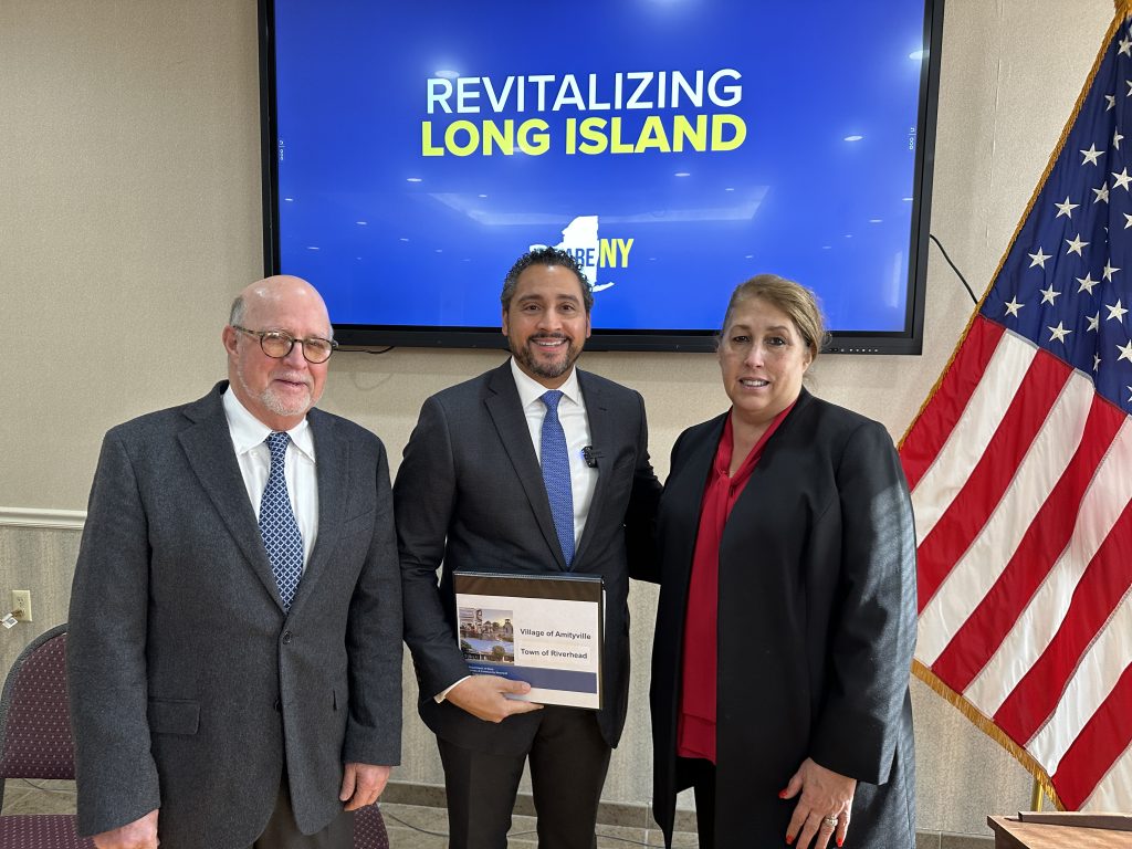 Downtown Redevelopment Initiative (DRI) Local Planning Commission Co-Chairs former Greenport Mayor David Kapell (left) and Riverhead Town Supervisor Yvette Aguiar (right) join NYS Secretary of State Robert J. Rodriguez (center) at the announcement of the projects to be funded under the state’s $10 million DRI grant.