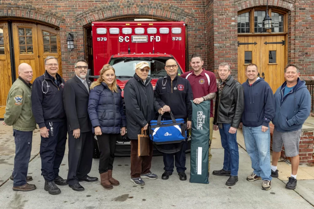 (Photo by Peter M. Budraitis) Legislator DeRiggi-Whitton and John Lalena outside the Sea Cliff Fire Department.