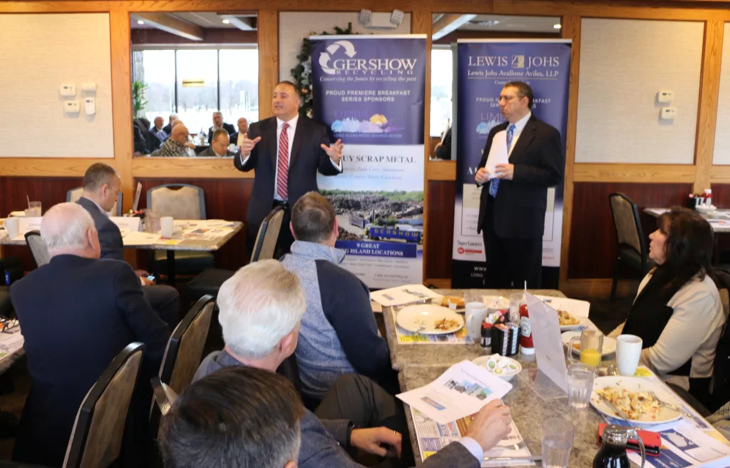 (Photo by Hank Russell) Marc Alessi (left) speaks to attendees about the future of wireless technology on Long Island at the LIMBA (Long Island Metro Business Action) meeting on January 13 in Commack as Extenet’s associate general counsel, Haran C. Rashes (right) looks on.