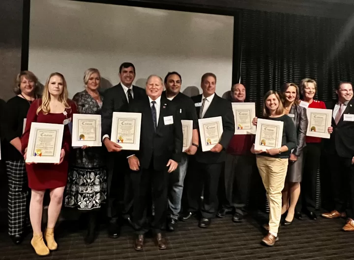 (Photo: Office of Legislator Arnold Drucker) Nassau County Arnold Drucker and Joshua Lafazan present citations to the members of the Woodbury-Syosset Chamber of Commerce as the chamber celebrates its 25th anniversary.