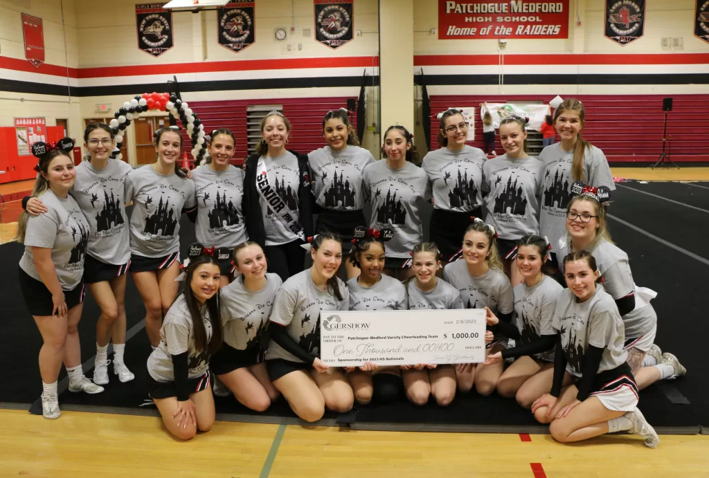 Members of the Patchogue-Medford High School cheerleading team pose with a check from Gershow Recycling in the amount of $1,000 on February 8. The money was used to pay for the costs associated with the trip to the Universal Cheerleading Association National High School Cheerleading Championship, which was held at Walt Disney World Resort in Orlando, Florida on February 10-12, 2023.