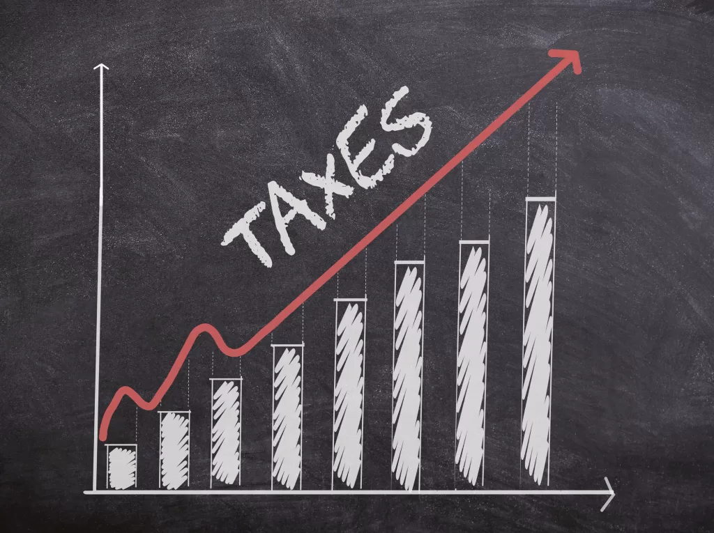 Tax Concept with histogram chart and curve going up. Tax increasing.