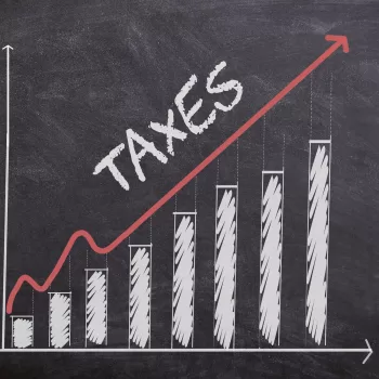 Tax Concept with histogram chart and curve going up. Tax increasing.