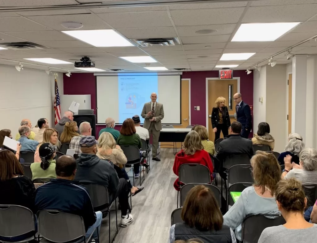 Office of Nassau County Legislator John Giuffré) Nassau County Legislator John Giuffré
addresses attendees at the Medicare Made Clear event at Franklin Square Public Library on April 11.