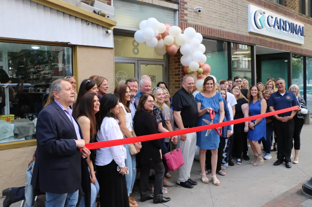 (Photo by Hank Russell) Christine Brennen-Chanowsky and her husband, Chris Chanowsky,
begin to cut the ribbon at the grand opening of Fire & Wixx on May 24. Also pictured are Greater
Patchogue Executive Director Dave Kennedy (left) and Suffolk County Legislator Dominick
Thorne (right).