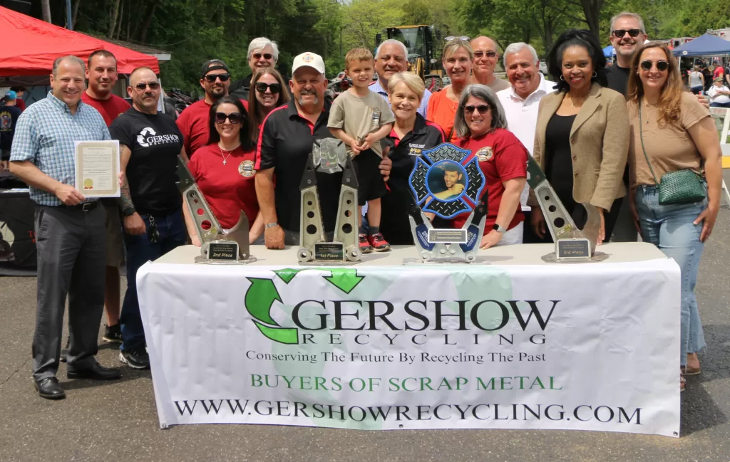 Pictured (front row, left to right): Huntington Town Clerk Andrew Raia, Gershow’s Huntington Facility Manager Rich D’Angelo, Rebecca Beach and her father, 16th Annual Chuck Varese Vehicle Extrication Tournament Co-Coordinator and former Northport Fire Chief Robert “Beefy” Varese; Mr. Varese’s grandson William Varese; Northport Fire Department Rescue Squad Lieutenant Jeanne Varese, Mr. Varese’s wife and co-coordinator of the 16th Annual Chuck Varese Vehicle Extrication Tournament; Northport Village Mayor Donna Koch, Huntington Receiver of Taxes Jillian Guthman, Esq., and Northport Village Trustee Meghan Dolan.

Back row (l-r) Northport Fire Chief Doug Pyne, Chief; Will and Jenny Varese, Mr. Varese’s son and daughter-in-law; Huntington Town Highway Superintendent Andre Sorrentino, Suffolk County Legislator Stephanie Bontempi, Gershow Vice President of Special Projects Steve Rossetti, and New York State Assemblyman Keith Brown.

Third row: Northport Village Trustee Ernest Pucillo and Northport Deputy Mayor Joe Sabia.