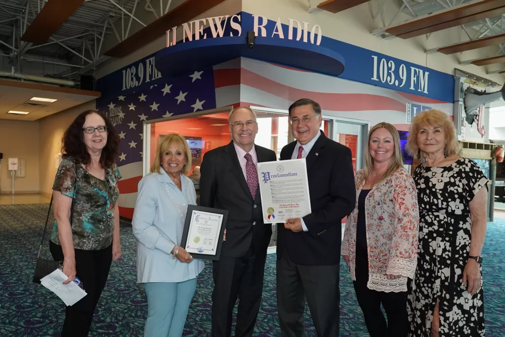 (Photo: Town of Brookhaven) Brookhaven Town Supervisor Ed Romaine (third from left) celebrated the 500th broadcast of  The Nonprofit Voice along with (l-r) Marketing Works Senior Writer and Public Relations Specialist Bernadette Starzee, Islip Town Supervisor Angie Carpenter, Marketing Works President and CEO Ron Gold, Media Works Vice President and Creative Director Melissa Rose and Federation of Organizations CEO Barbara Faron.