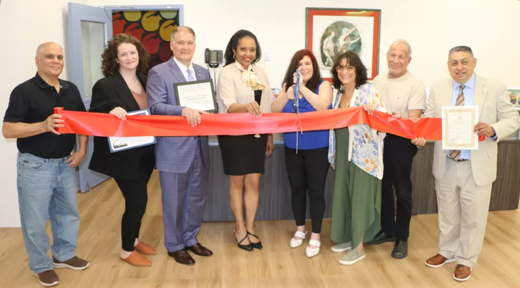 Pictured (left to right): The Marcus Center for the Performing Arts Theater and Music Coordinator Lou Allacco, Huntington Township Chamber of Commerce Board Member Kiera McCourt, New York State Senator Mario Mattera, Huntington Town Receiver of Taxes Jillian Guthman, Esq., The Marcus Center for the Performing Arts CEO Stella Roberg, Marcus Center Treasurer Patti Silverman, her husband Jeffrey Silverman, who volunteers at the Marcus Center,  and Huntington Town Director of Community Development Angel Cepeda.