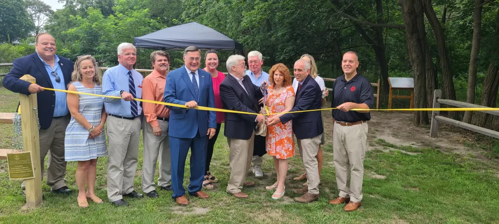 (Photo Courtesy of the Town of Brookhaven) Brookhaven Town Supervisor Ed Romaine (center) and Deputy Supervisor Dan Panico (right) took part in the dedication of the Andrea Spilka Preserve in Eastport.