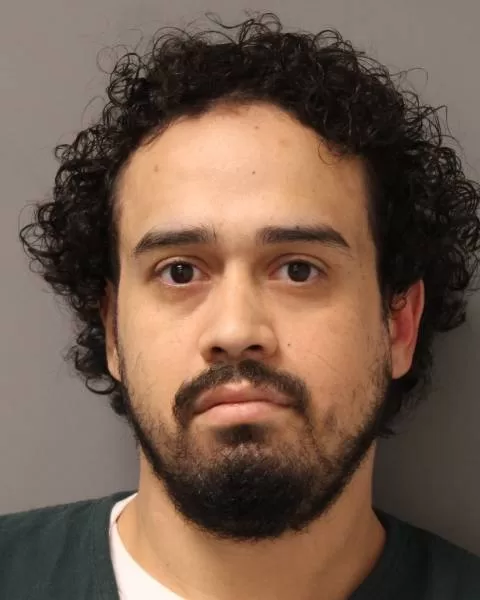 (Photo Courtesy of the Suffolk County DA’s Office)  Wilfredo Figueroa, 29, of Ridge, pleaded guilty to robbery and gun possession after shooting a 27-year-old victim in the face.
