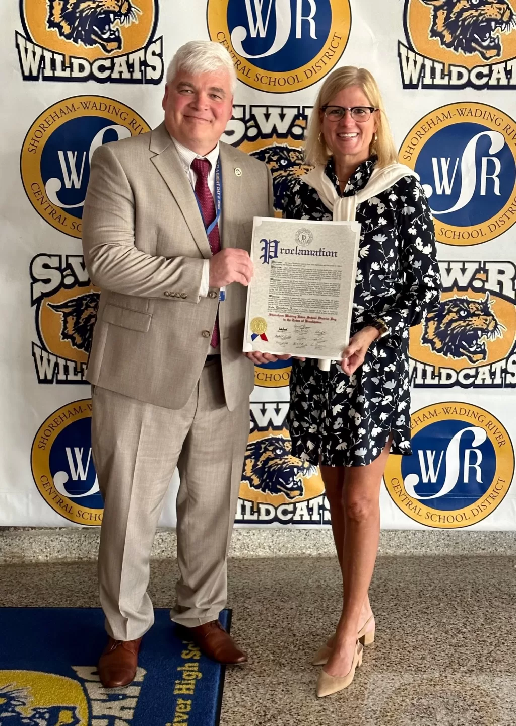 (Photo: Town of Brookhaven) Town of Brookhaven Councilwoman Jane Bonner (right) presents a proclamation to Shoreham-Wading River School District Superintendent Jerry Poole (left) commemorating the school district’s 50th anniversary.