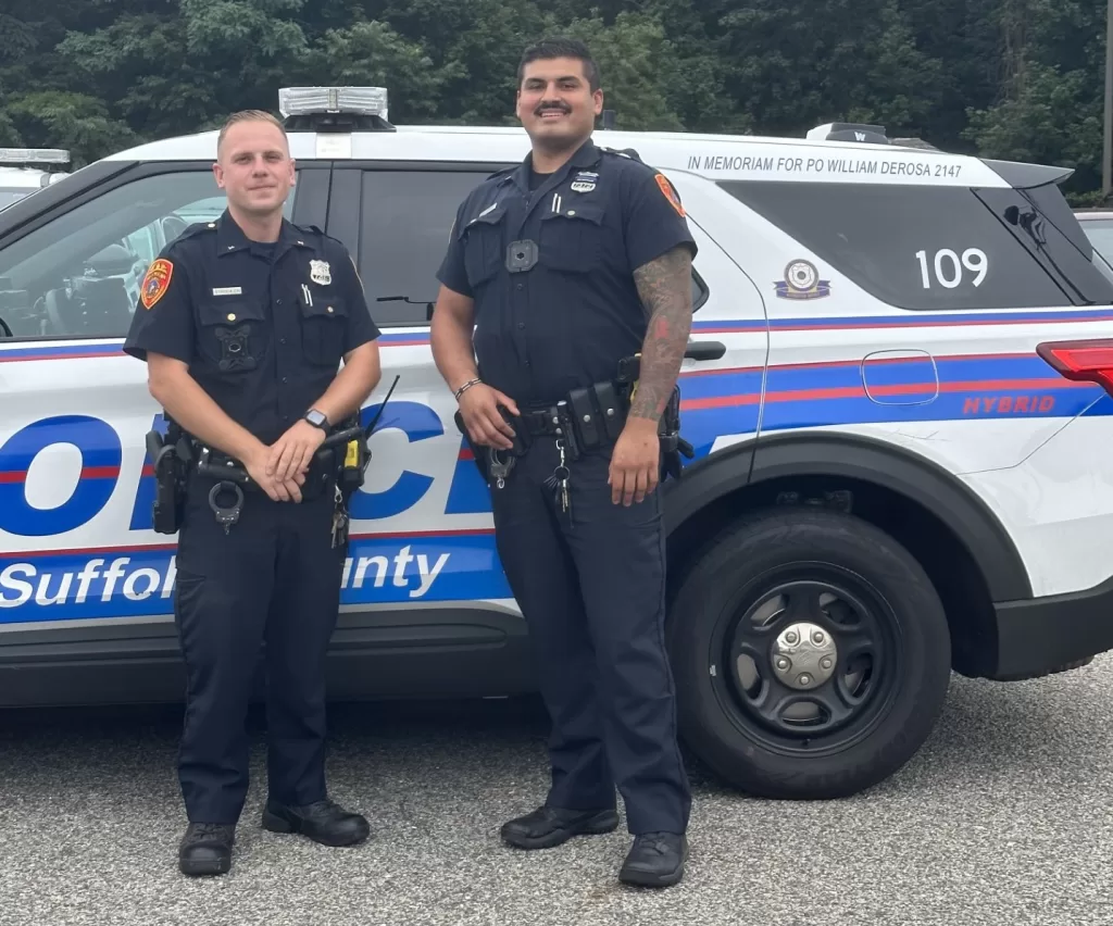 (Photo Courtesy of SCPD) Suffolk police officers Michael Stroehlein and Diego Montero of the First Precinct helped deliver a baby at a home in Amityville on the morning of August 17.