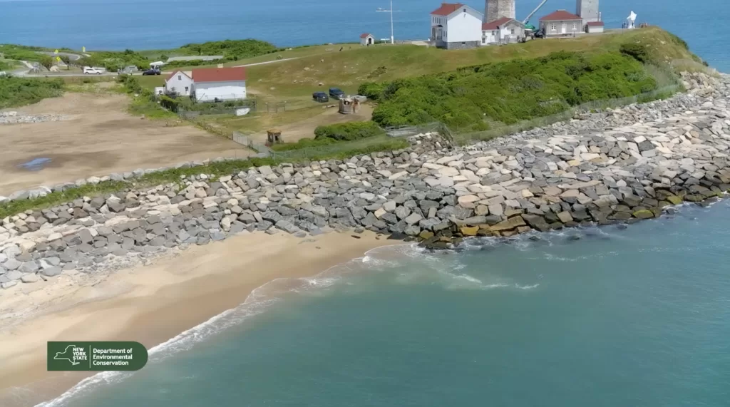 (Screen shot from video courtesy of NYS DEC) This photo shows the restoration of the Montauk Point Lighthouse and the nearby coastline.