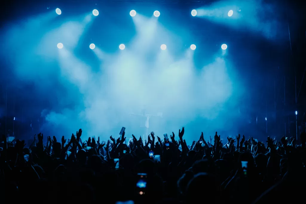 Crowd of people dancing at a music show in Barcelona during the summer of 2022