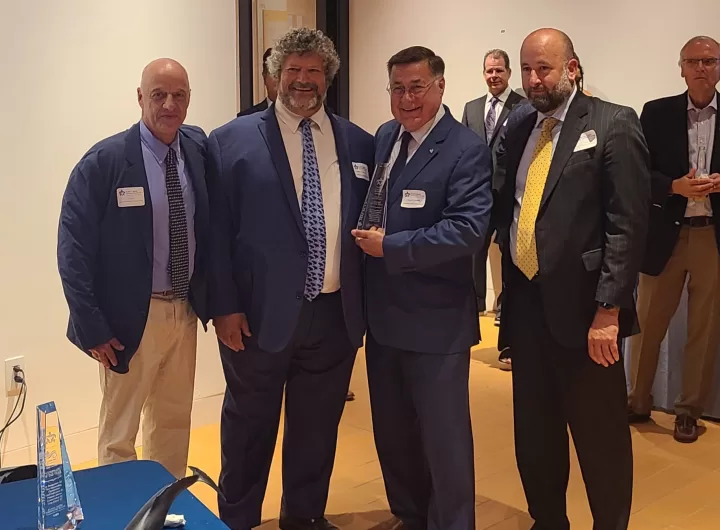 (Photo: Town of Brookhaven) Pictured (left to right) are AMCS Board President Paul Tonna; AMCS Founder and Chief Scientist,Robert A. DiGiovanni, Jr.; Brookhaven Town Supervisor Ed Romaine and AMCS Board Vice President and Treasurer Thomas Telesca.
