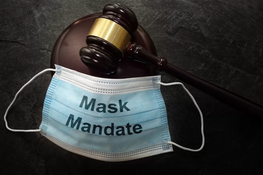 Court legal gavel and Mask Mandate facemask
