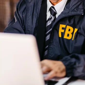 FBI Detective Using Laptop In His Office