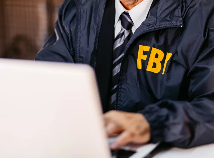 FBI Detective Using Laptop In His Office