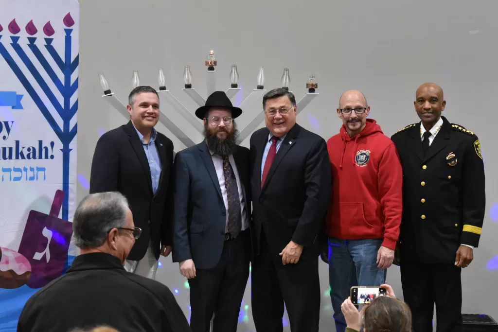 (Photo: Town of Brookhaven) Pictured (left to right): Brookhaven Town Clerk Kevin LaValle, Rabbi Mendy Goldberg of the Lubavitch of the East End/Chabad House of Coram, Brookhaven Town Supervisor Ed Romaine, New York State Senator Dean Murray and Suffolk County Sheriff Errol Toulon. 