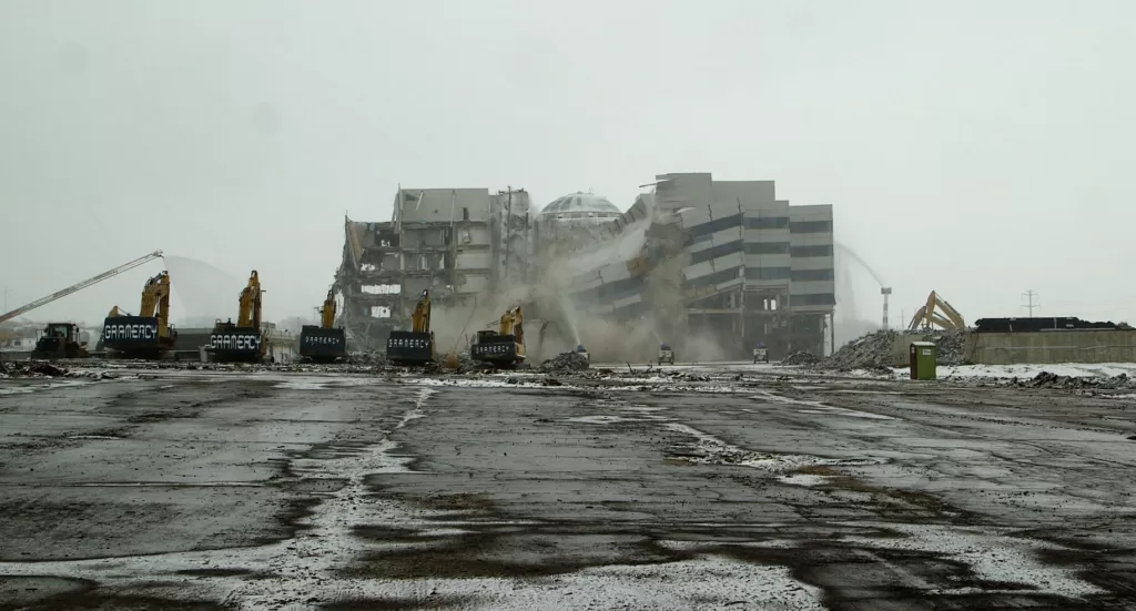 (Screen grab: Freddie Cain) A part of the former Computer Associates building in Islandia comes down during an implosion on January 19.