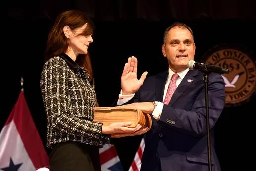 (Photo Courtesy of Town of Oyster Bay) Oyster Bay Town Supervisor (right) is sworn in during the town's inauguration ceremony in Farmingdale on Jaunuary 8.