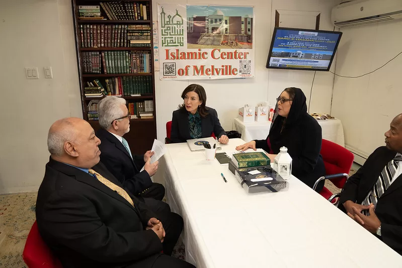 (Photo: Office of Governor Kathy Hochul) New York Governor Kathy Hochul (center) and New York State Police Superintendent Stephen G. James (right) meet with the leaders of Islamic Center of Melville on February 26.