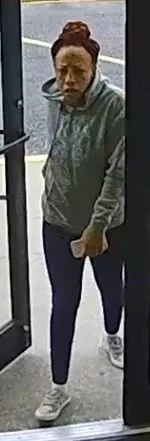 (Photo Courtesy of SCPD) This woman was seen leaving with stolen merchandise from Carter's in Patchogue on February 22.