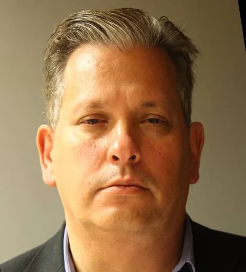 (Photo Courtesy of the Suffolk County DA's Office) David Ostrove was found guilty of stealing over $8 million from a private school in Williston Park, where he worked as its chief financial and technology officer.