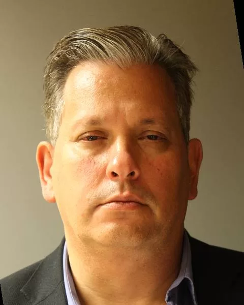 (Photo Courtesy of the Suffolk County DA's Office) David Ostrove was sentenced to 8-1/3 to 25 years in prison for stealing over $8 million from a private school in Williston Park, where he worked as its chief financial and technology officer.