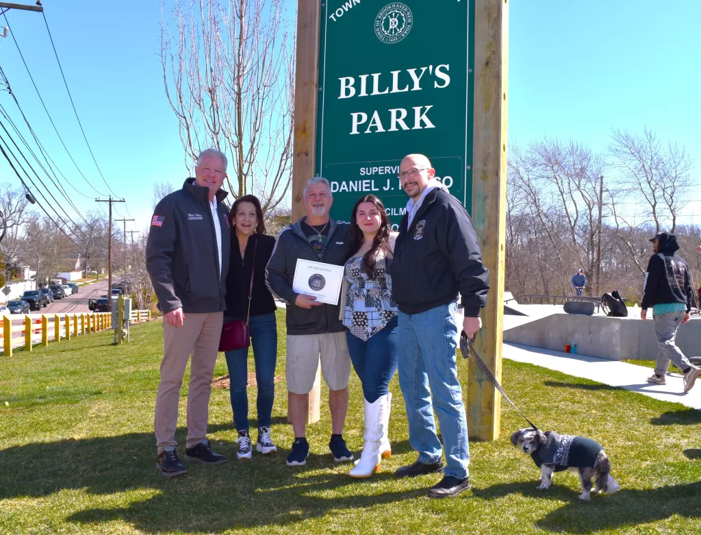 (Photo: Town of Brookhaven) Pictured left to right are Brookhaven Town Councilman Neil Foley; Joanne, Luigi and Marissa Schettino;
New York State Senator Dean Murray and his dog, “Petey.”