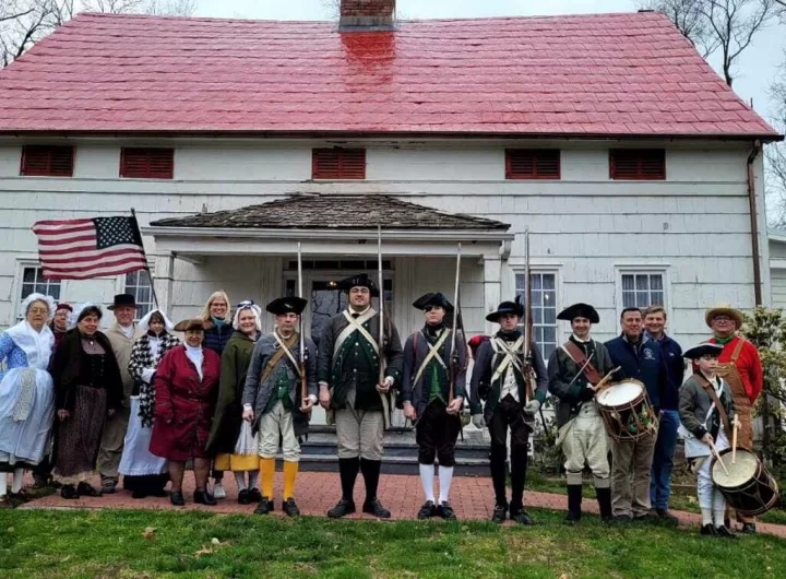 (Photo: Town of Brookhaven) Brookhaven Town Councilwoman Jane Bonner (back row, left) joins the members of the Rocky Point Historical Society during its traditional encampment at the Hallock Homestead Museum on April 6.