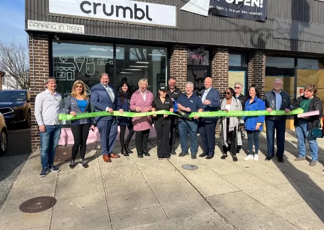 (Photo: Office of Legislator Seth I. Koslow) Nassau County Legislator Seth I. Koslow joins the Merrick Chamber of Commerce in the ribbon cutting to celebrate the grand opening of Crumbl Cookies in Merrick on April 19.