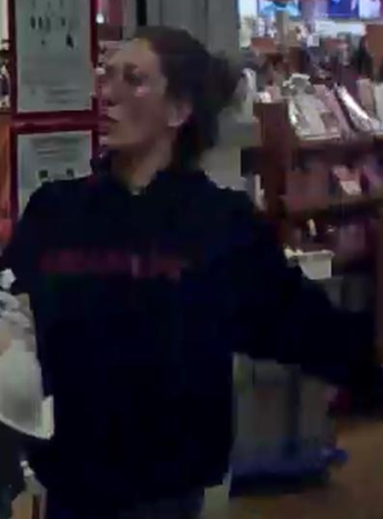 (Photo Courtesy of SCPD) This woman is wanted for stealing clothing from a Medford store.