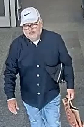 (Photo Courtesy of SCPD) This man is wanted for stealing a woman's purse in Riverhead, then charging over $800 on her credit cards while in Medford.