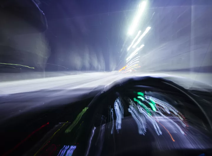 blur motion inside car light trail represent moving car or drunk driver
