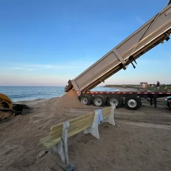 (Photo: Town of East Hampton) Sand is being poured onto Ditch Plains Beach in East Hampton as part of a dune and beach recovery project.