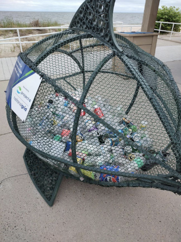 (Photo courtesy of Town of Riverhead) Giant “Fish” Trash Receptacle in Riverhead is about to
be emptied for the First Time. The unique fish is filling up with recyclable
containers.