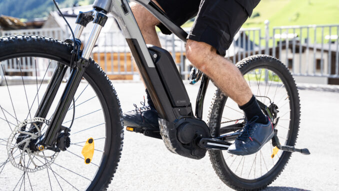 Man Riding E Bike Bicycle In City