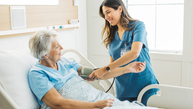 Senior woman in hospital bed
