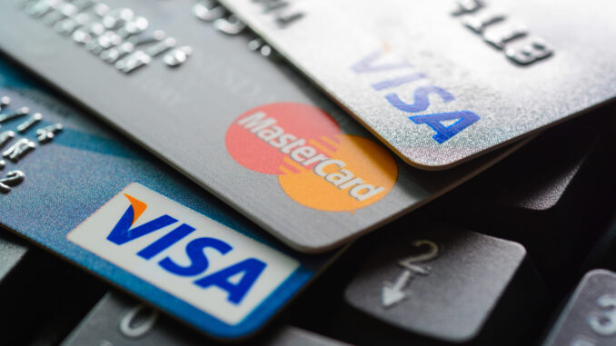 Group of credit cards on computer keyboard