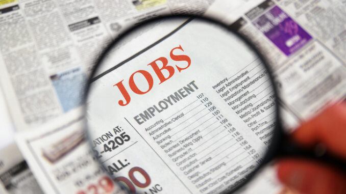 Job searching on newspaper using magnifier