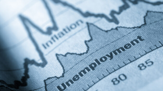 Folded sheet of paper with an unemployment graph on