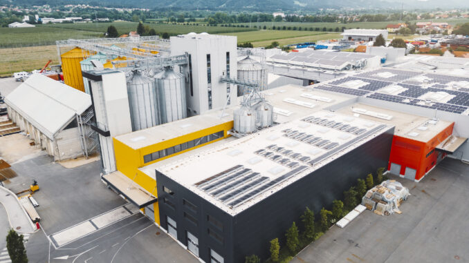 Aerial view of industrial area interwoven with a network of structures, machinery, and infrastructure, complex of industrial activity