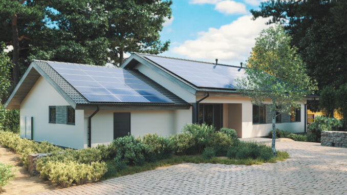 Energy Efficient House With Solar Panels And Wall Battery For Energy Storage